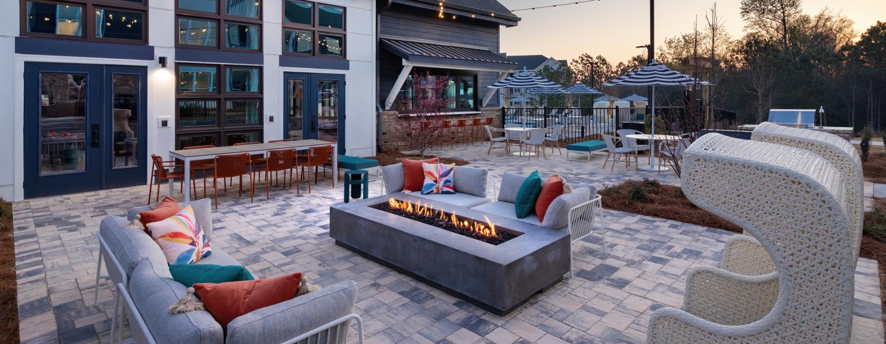 a patio with chairs and a couch