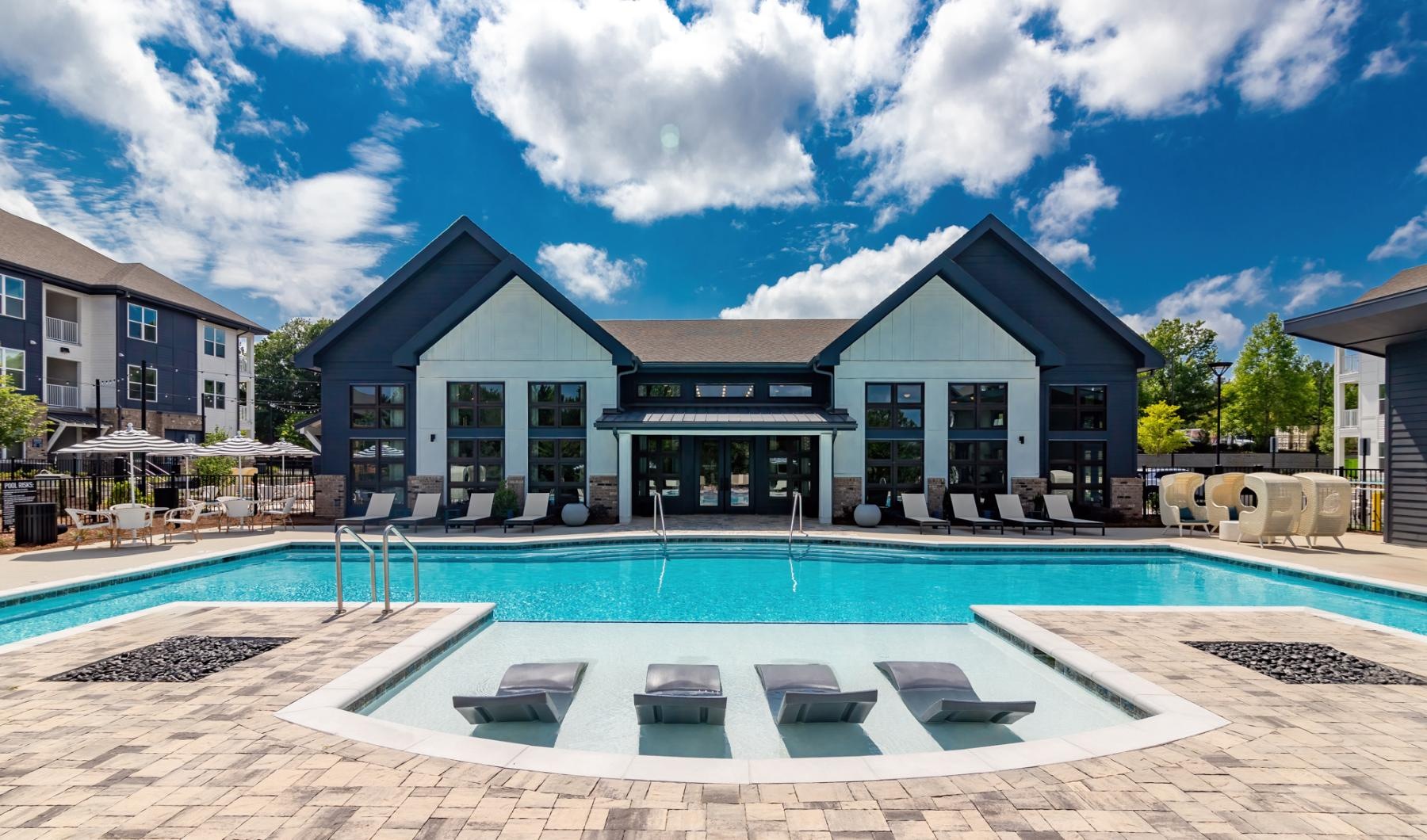 a swimming pool in front of a house