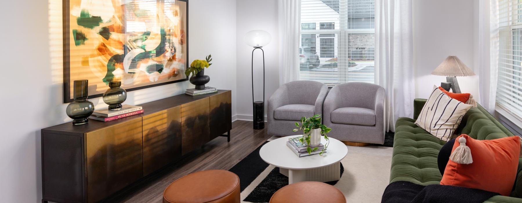 a living room with a large painting